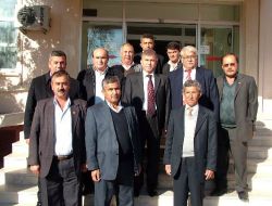 Tarsuslu Muhtarlar Kadirli Kaymakamı Ulusoy'u Ziyaret Etti