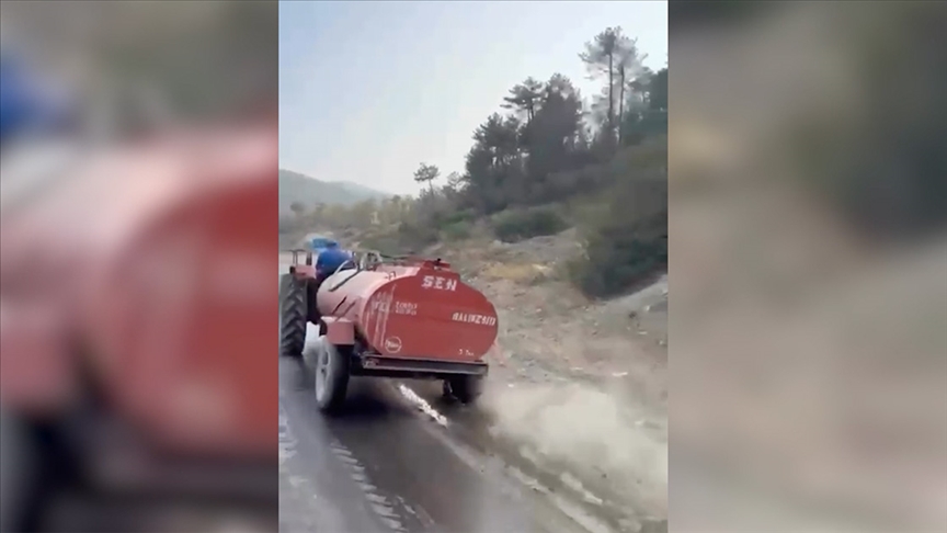 BURSA'DA BİR ÇİFTÇİ, PATLAYAN LASTİĞE RAĞMEN YANGINA SU TAŞIDI